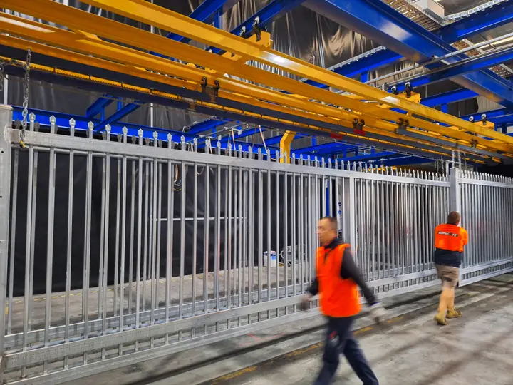 Industrial powder coating process on metal fence