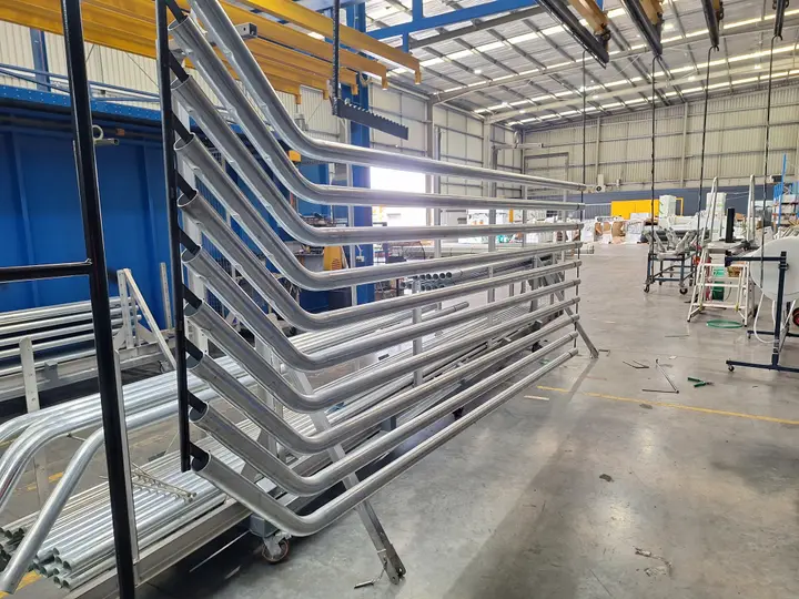 Metal frames in powder coating workshop