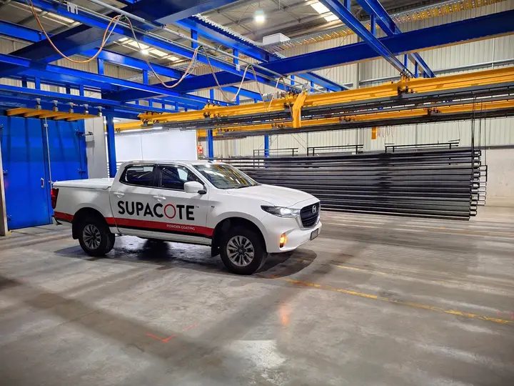 Powder coating facility with truck and equipment