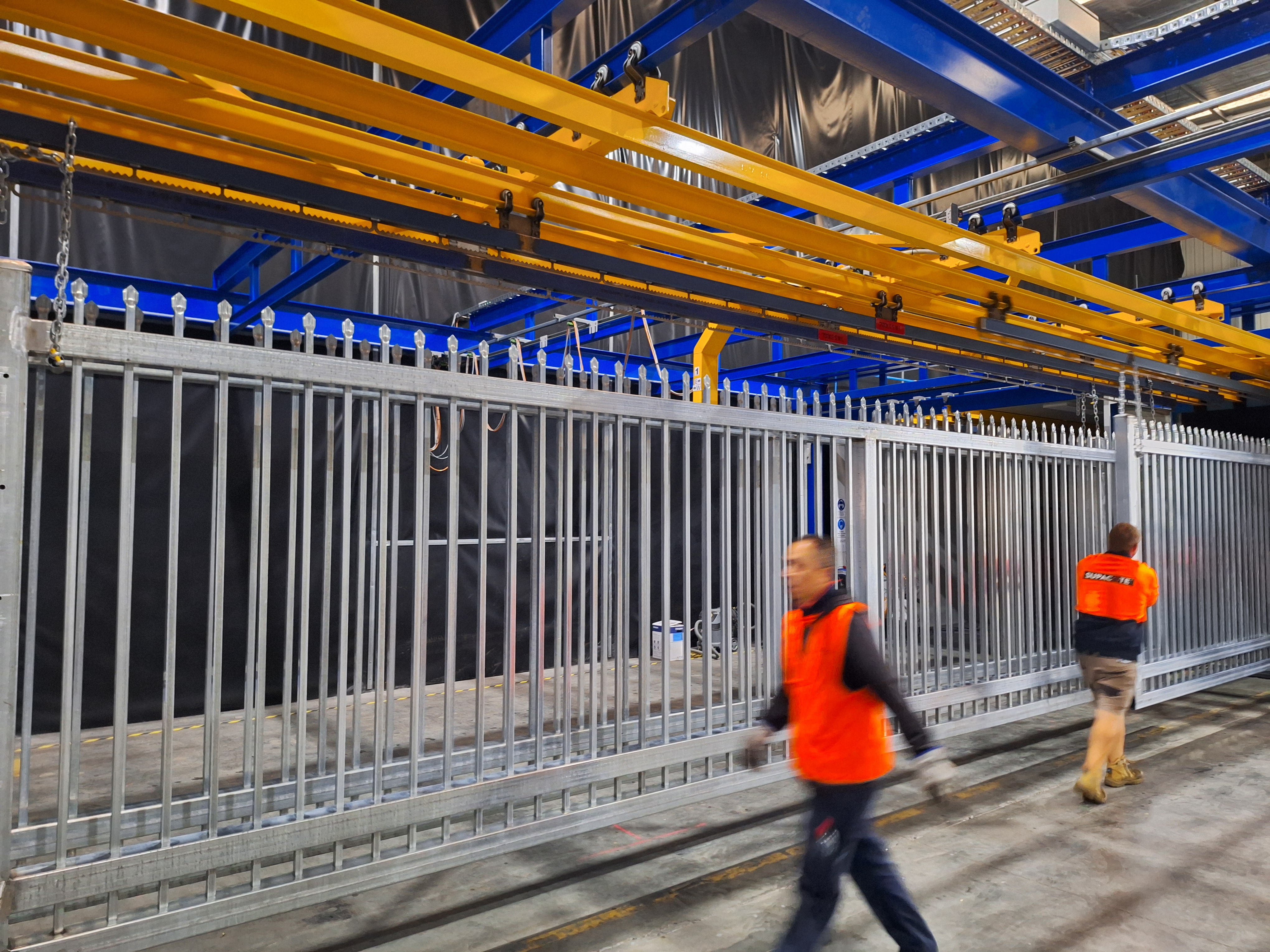 Industrial_powder_coating_process_on_metal_fence